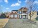 Charming two-story home with stone accents, a double porch, and manicured landscaping at 1062 Baldwin Dr, Lancaster, SC 29720