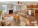 Bright living room featuring a fireplace, hardwood floors, and an open layout to the kitchen at 1062 Baldwin Dr, Lancaster, SC 29720