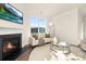 Bright living room with a cozy fireplace, large window with great natural light, and comfortable seating at 109 Noah Ln, Troutman, NC 28166