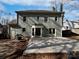 Exterior view of home featuring a large concrete patio and a well-maintained backyard at 10906 Falls Branch Ln, Charlotte, NC 28214