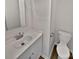 Bathroom featuring white sink vanity, faucet, and toilet at 10906 Falls Branch Ln, Charlotte, NC 28214