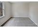 Bedroom featuring neutral paint, carpet, and large window at 10906 Falls Branch Ln, Charlotte, NC 28214