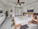 Serene staged bedroom with vaulted ceiling, neutral tones, and modern decor at 10906 Falls Branch Ln, Charlotte, NC 28214
