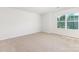 Bright bedroom with carpeted floors and a window at 111 Rustling Waters Dr, Mooresville, NC 28117