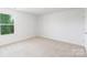 Bedroom featuring carpeted floors and a window with view at 111 Rustling Waters Dr, Mooresville, NC 28117