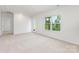 Living room with carpeted floors and large window with a view at 111 Rustling Waters Dr, Mooresville, NC 28117