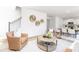 Spacious living room with open floor plan, modern furniture, and natural décor accents at 111 Rustling Waters Dr, Mooresville, NC 28117