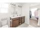 Bathroom with double vanity sinks and walk-in closet at 112 Buoy Ln, Statesville, NC 28677