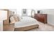 Well-lit bedroom with large bed, dresser, and lots of natural light from the windows at 112 Buoy Ln, Statesville, NC 28677