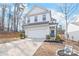 Charming two-story home featuring a welcoming entrance, attached garage, and a well-maintained front yard at 112 Buoy Ln, Statesville, NC 28677
