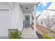 Inviting entryway featuring a gray front door adorned with a wreath and a 'Welcome' mat and sign at 112 Buoy Ln, Statesville, NC 28677