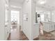 Open-concept hallway with views of the dining room, kitchen, and living areas at 112 Buoy Ln, Statesville, NC 28677