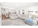 Open concept living room with great natural light, hardwood floors, and modern decor at 112 Buoy Ln, Statesville, NC 28677