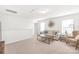 Upstairs loft with light-colored carpet, sofa, and windows at 112 Buoy Ln, Statesville, NC 28677