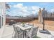 Outdoor patio with dining set, umbrella, and ample space for entertaining and enjoying the outdoors at 112 Buoy Ln, Statesville, NC 28677