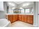 Bathroom featuring a double vanity with a large mirror, a soaking tub, and tile flooring at 1126 Snowbird Ln, Waxhaw, NC 28173