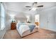 Bedroom featuring a comfortable bed with side tables and bright natural light from windows at 1126 Snowbird Ln, Waxhaw, NC 28173