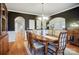 Formal dining room featuring hardwood floors, classic decor and access to multiple rooms at 1126 Snowbird Ln, Waxhaw, NC 28173