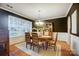 Formal dining room with stylish chandelier, hardwood floors, and elegant furniture at 1126 Snowbird Ln, Waxhaw, NC 28173