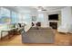 Comfortable living room with corner fireplace, neutral color scheme, and hardwood floors at 1126 Snowbird Ln, Waxhaw, NC 28173