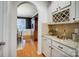 Butler's pantry including a wine rack and beautiful granite countertops at 1126 Snowbird Ln, Waxhaw, NC 28173