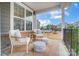 Inviting front porch with comfortable seating, perfect for relaxing and enjoying the neighborhood view at 1126 Snowbird Ln, Waxhaw, NC 28173