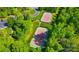 Aerial view of two well-maintained tennis courts surrounded by lush greenery, offering a recreational amenity at 1126 Snowbird Ln, Waxhaw, NC 28173