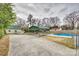 Spacious backyard with a pool, carport, and shed at 119 Hemphill Ave, Chester, SC 29706