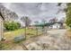 Wide angle view of the backyard showing the pool, garden beds and detached building at 119 Hemphill Ave, Chester, SC 29706