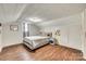 Bedroom with hardwood floors, a cozy bed, and a small window, creating a simple, comfortable retreat at 119 Hemphill Ave, Chester, SC 29706