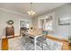 Charming dining room with hardwood floors, a modern rug, and plenty of natural light at 119 Hemphill Ave, Chester, SC 29706