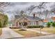 Lovely single-story brick home featuring a mature landscaped yard with a long driveway at 119 Hemphill Ave, Chester, SC 29706
