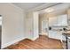 Eat-in kitchen featuring white cabinets, stainless appliances, and great natural light at 119 Hemphill Ave, Chester, SC 29706