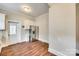 Spacious eat-in kitchen with stainless steel refrigerator and hardwood style floors at 119 Hemphill Ave, Chester, SC 29706