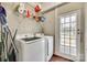 Well-equipped laundry room with modern washer and dryer and ample storage space at 119 Hemphill Ave, Chester, SC 29706