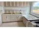 Unfinished bathroom featuring a tub with white cabinets and drawers, ready for personalization at 13248 Chopin Ridge Rd, Huntersville, NC 28078
