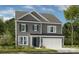 New two-story home boasts charming architectural details and well-maintained landscaping at 13248 Chopin Ridge Rd, Huntersville, NC 28078