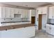 Bright, spacious kitchen featuring white cabinets and an island, prepped for modern appliances at 13248 Chopin Ridge Rd, Huntersville, NC 28078