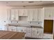 Bright kitchen featuring white cabinets, subway tile backsplash, and modern finishes at 13248 Chopin Ridge Rd, Huntersville, NC 28078