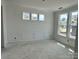 Bright room with decorative wall trim, three large windows offering ample natural light at 13248 Chopin Ridge Rd, Huntersville, NC 28078