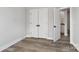 Bedroom featuring closet with doors and access to the bathroom at 143 Carriage Club Dr # 102, Mooresville, NC 28117