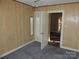Bedroom featuring wood paneling and carpeted floors at 146 Loomis St, Chester, SC 29706