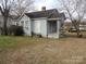 Exterior view of a single-story home with a covered porch and mature trees at 146 Loomis St, Chester, SC 29706