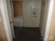 Hallway featuring carpet, plain white walls, and view into another room at 146 Loomis St, Chester, SC 29706
