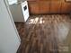 View of the kitchen flooring and white appliances at 146 Loomis St, Chester, SC 29706