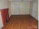 The living room features wood laminate flooring and a red brick fireplace at 146 Loomis St, Chester, SC 29706