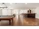 Spacious basement with a pool table and bar is perfect for entertaining and relaxing at 1506 Venetian Way Dr, Waxhaw, NC 28173