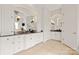 Bathroom featuring granite countertops, tile flooring, white cabinets, and dual sinks with plenty of space at 1506 Venetian Way Dr, Waxhaw, NC 28173