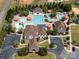 Aerial view of resort style community pool with multiple water features and umbrella tables at 1506 Venetian Way Dr, Waxhaw, NC 28173