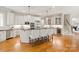 Modern kitchen with stainless steel appliances, kitchen island, and counter seating at 1506 Venetian Way Dr, Waxhaw, NC 28173